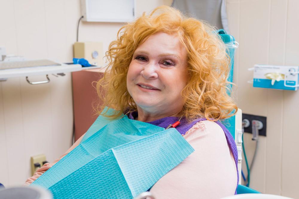 woman smiling after Periodontal disease treatment at Philadelphia Dentist