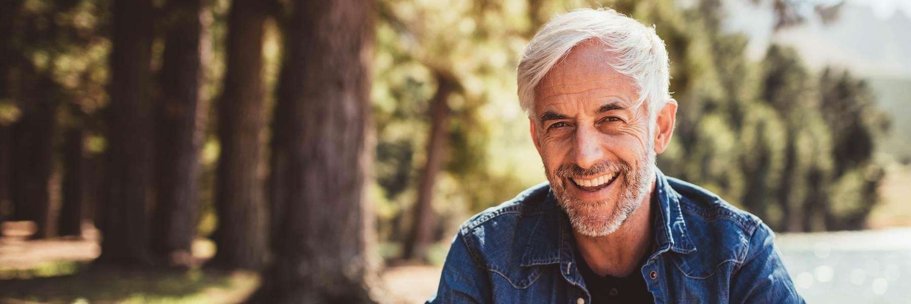 Man smiling after getting dentures in Philadelphia, PA
