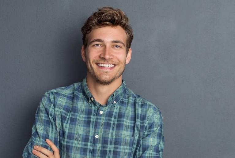 A man smiling after getting Veneers in Northeast Philadelphia