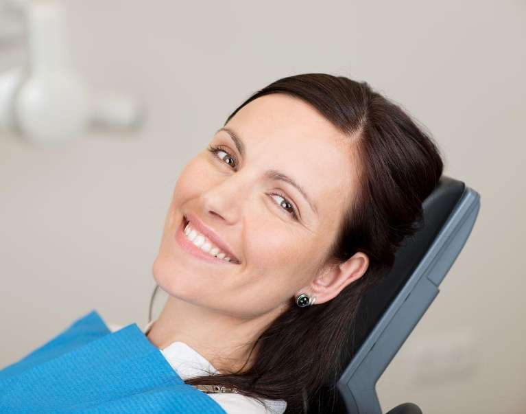 A female patient after a dental treatment in Philadelphia, PA