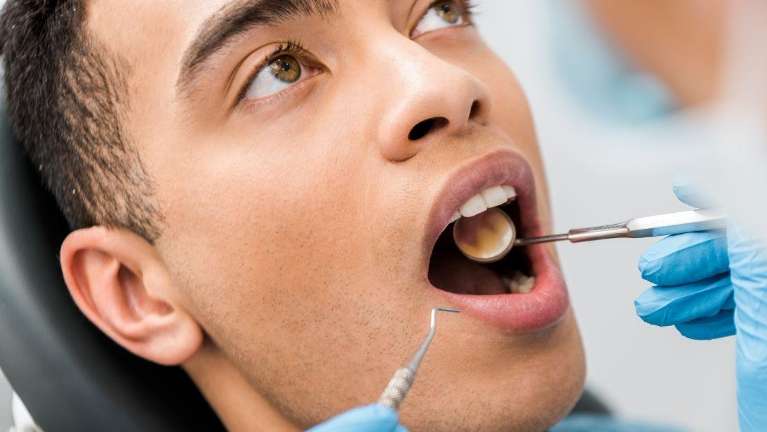 Lady undergoing gum disease treatment in Philadelphia, PA