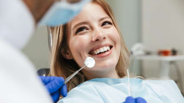Lady smiling during dental emergency treatment in Philadelphia, PA