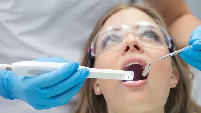 Lady undergoing gum disease treatment in Philadelphia, PA