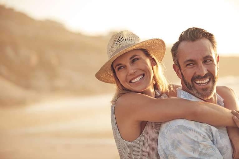 A couple smiling after a cosmetic dentistry in Northeast Philadelphia