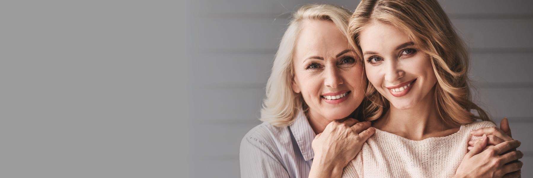 Two women smiling after getting Dental Implants in Northeast Philadelphia