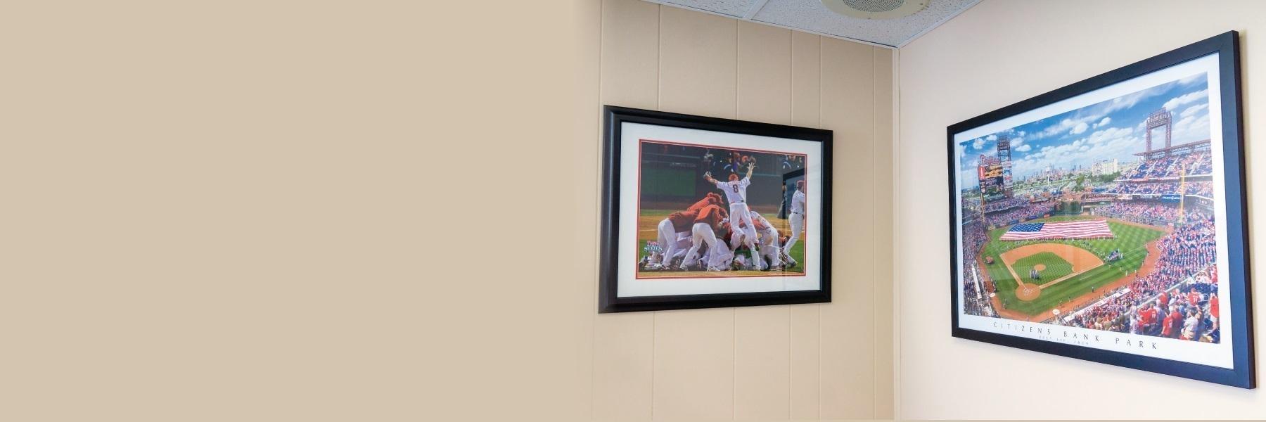 two framed baseball photos on wall of Philadelphia dental office