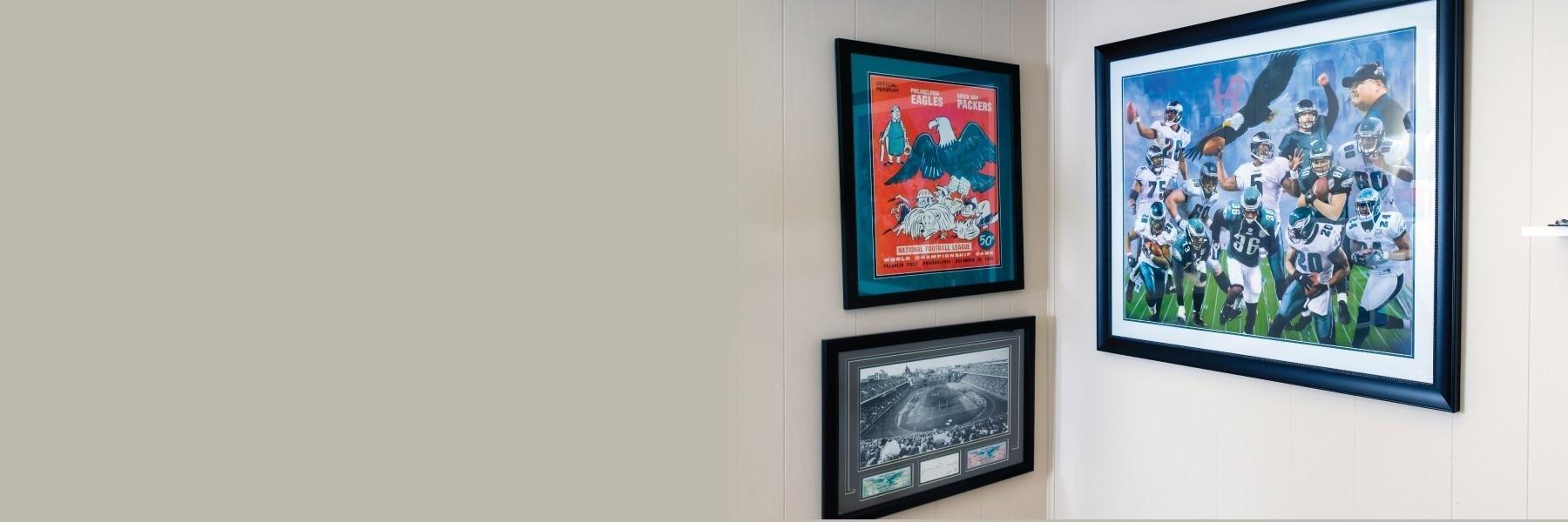 Framed philadelphia eagles memorabilia on wall