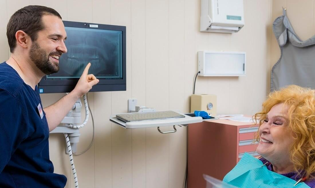 dentist showing a patient her x-ray in Philadelphia